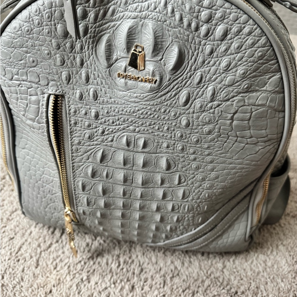 Gray Textured Backpack with Gold Hardware